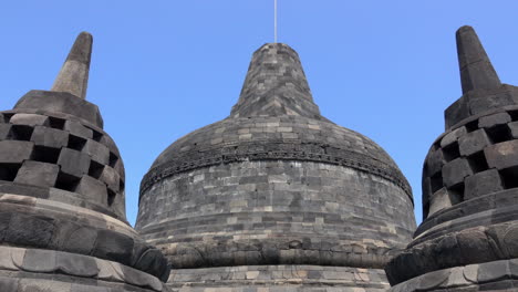 pan across summit stupas at borobudur temple.