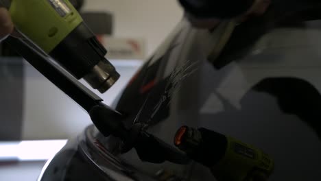 car window tinting pushing air bubbles out from under the foil