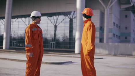 construction workers showing thumbs up