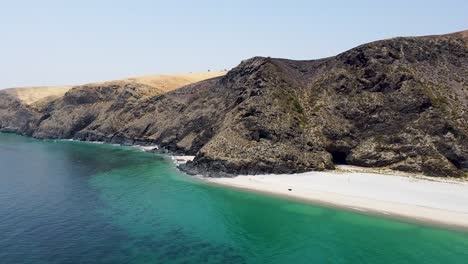 the bright clean waves and beach of rapid bay in south australia by the mountains - aerial