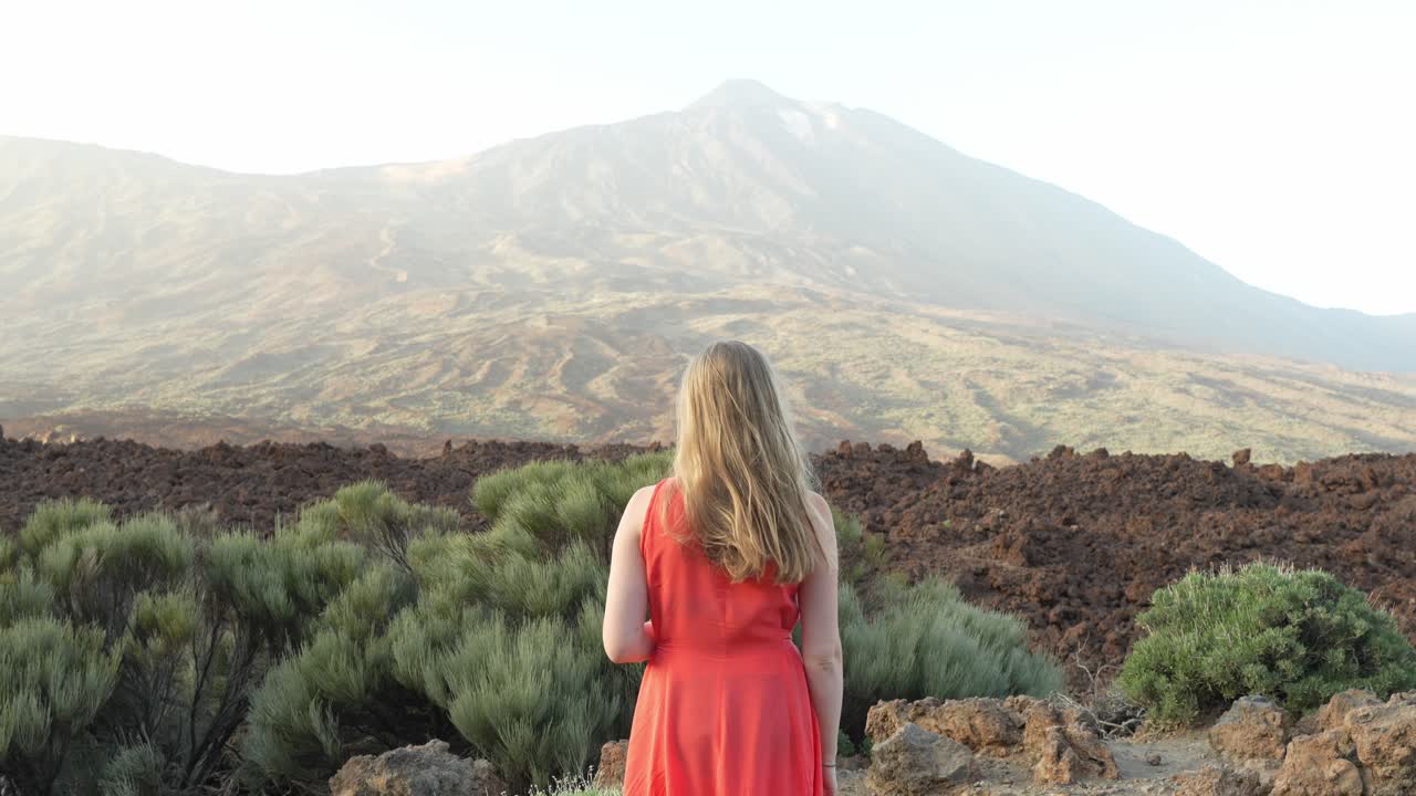 Solo female traveller cherishing memories at Teide National Park