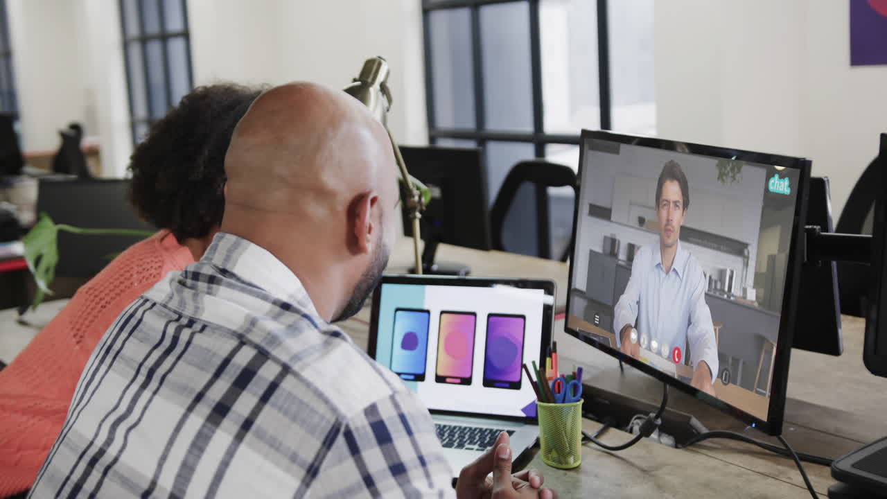 African american business people on video call with caucasian male colleague on screen