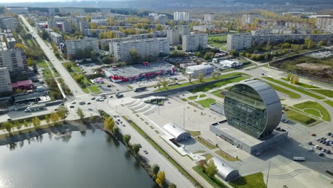 aerial view of a city with modern architecture and a round building