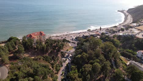 4k aerial drone approaching the scenic pacific coast (hwy1) in malibu, los angeles, california. footage taken prior to the january 2025 pacific palisades fire.