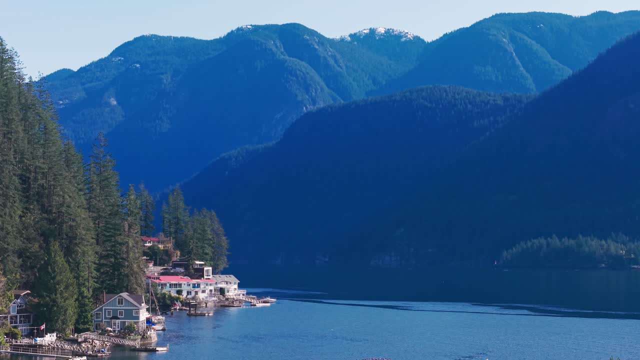 A scenic drone of beautiful mountains along the Indian Arm River in North Vancouver