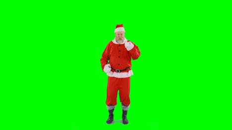 Santa-claus-dancing-against-green-background