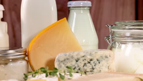 various dairy items displayed on a wooden surface