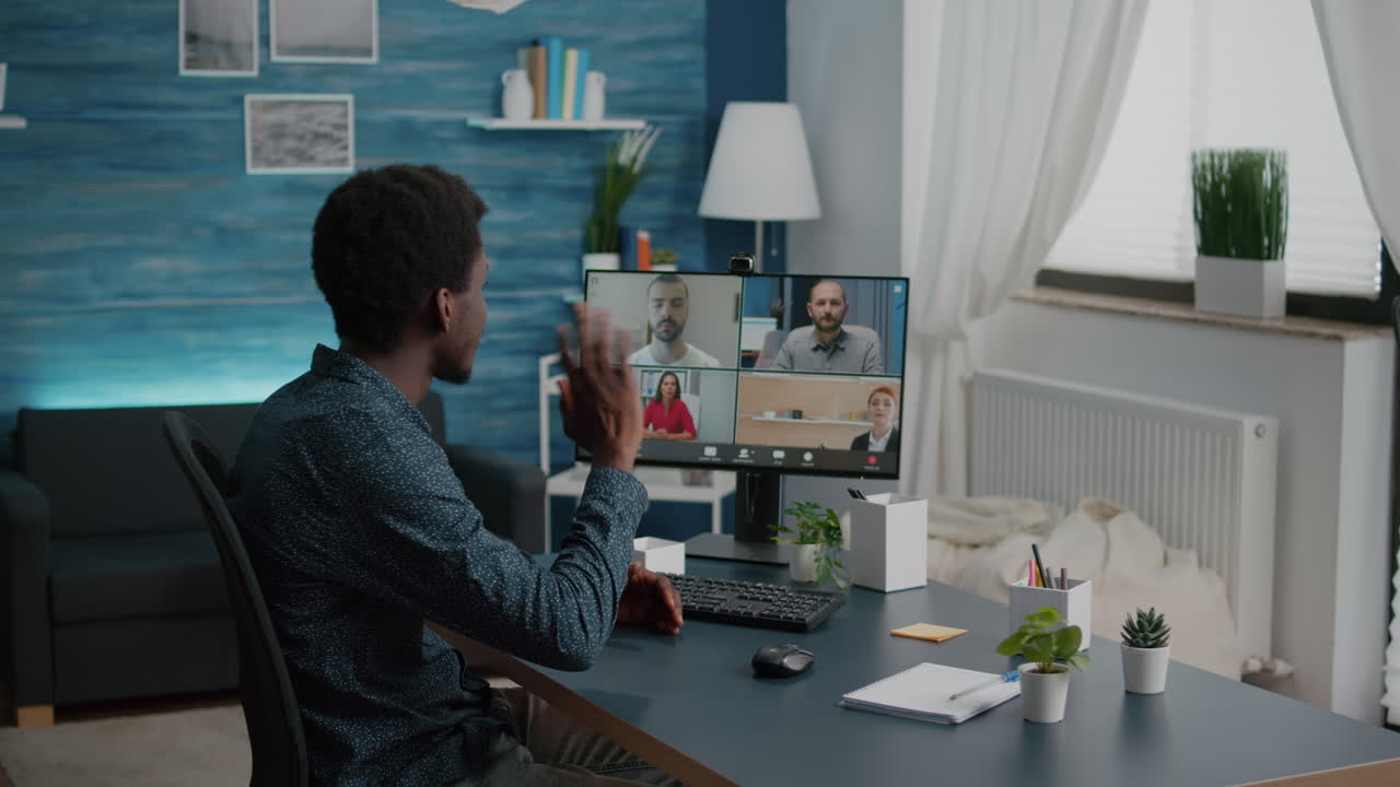 Black man on online internet conference chat with his coworkers