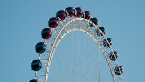 sokcho eye - ferris wheel against blue sky at sunset in sokcho city, south korea