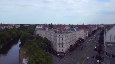 Great-aerial-top-view-flight-City-Berlin-district-Neukoeln-canal-bridge-river,-Germany-Summer-day-2023