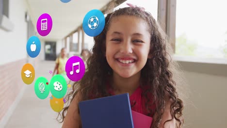 Animation-of-school-icons-over-smiling-biracial-schoolgirl-in-school-corridor