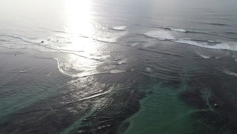 aerial view. aerial drone footage of ocean waves in the sunrise