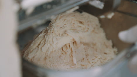 slow motion of finely grounded almond flour food processor, grinding almonds for making marzipan