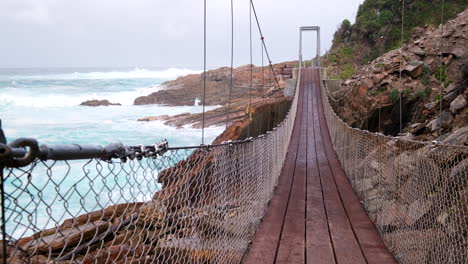 iconic storms river suspension footbridge at sanparks tsitsikamma. slider shot
