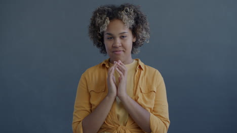 woman with curly hair praying