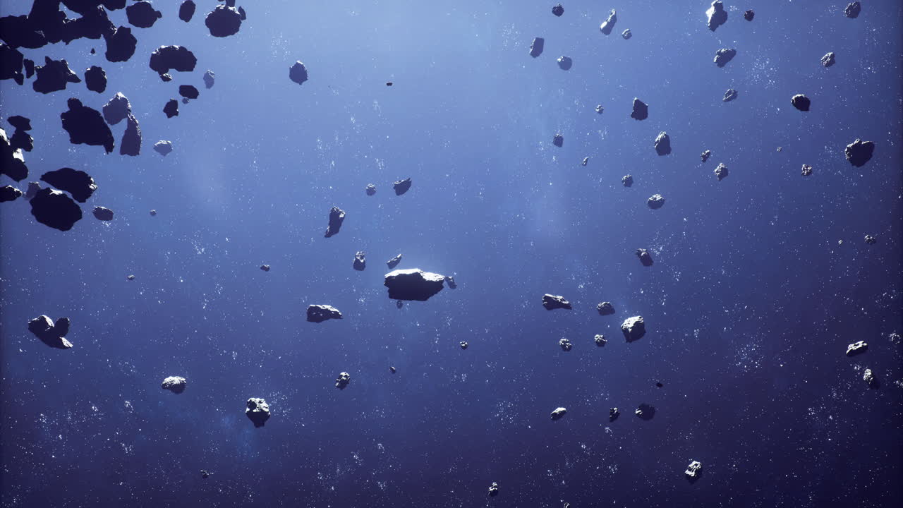 Asteroids floating in space create a mesmerizing cosmic display