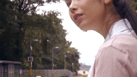 businesswoman using tablet on train platform