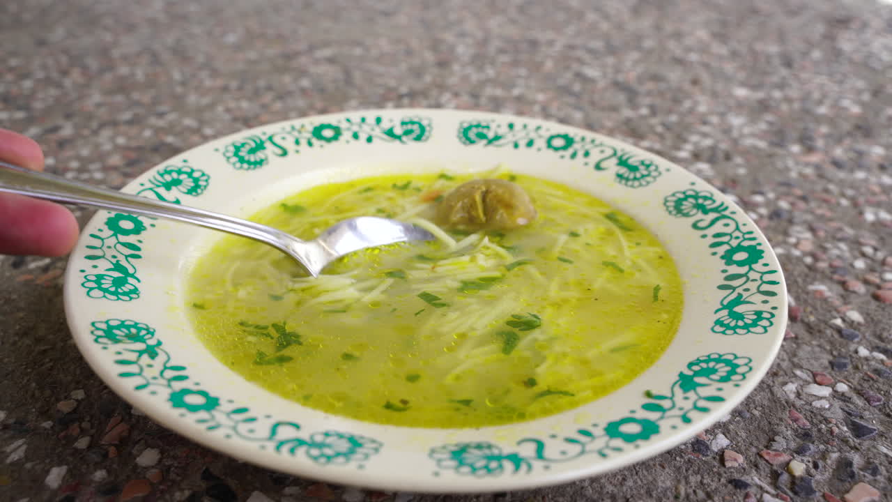 Traditional soup on a concrete table