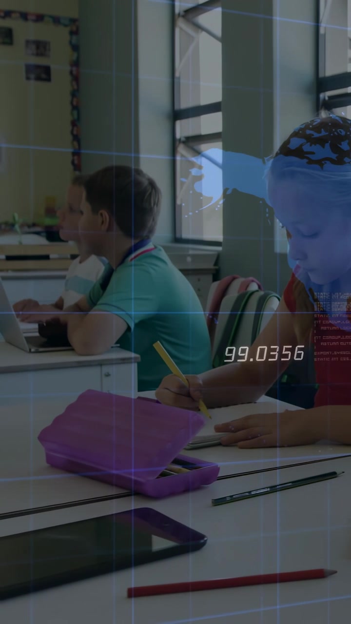Vertical video: Girl writing notes in class while tablet showing globe 99