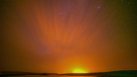 timelapse shot of milky way galaxy stars at night sky with sun rising over the horizon