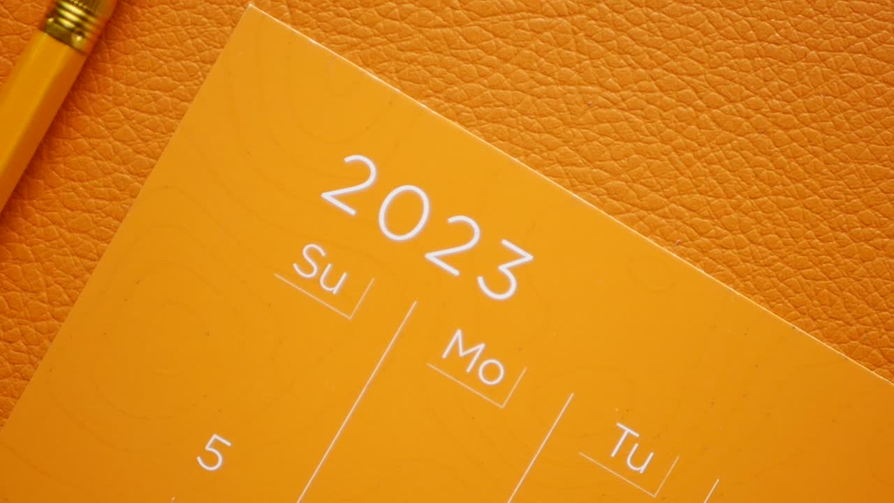 Orange 2023 Calendar with Pencil