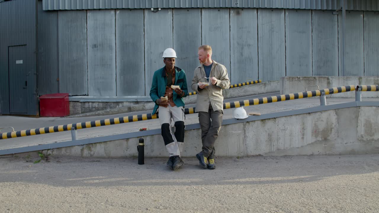 Workers Enjoying Lunch Break at Industrial Facility