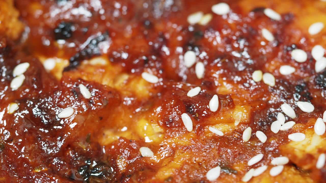 Close-up of grilled eel with sesame seeds and teriyaki sauce
