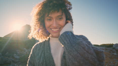 happy model posing sunshine at wild coast portrait. laughing girl looking camera