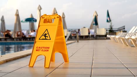 watch for slippery tile floor yellow warning sign background loop