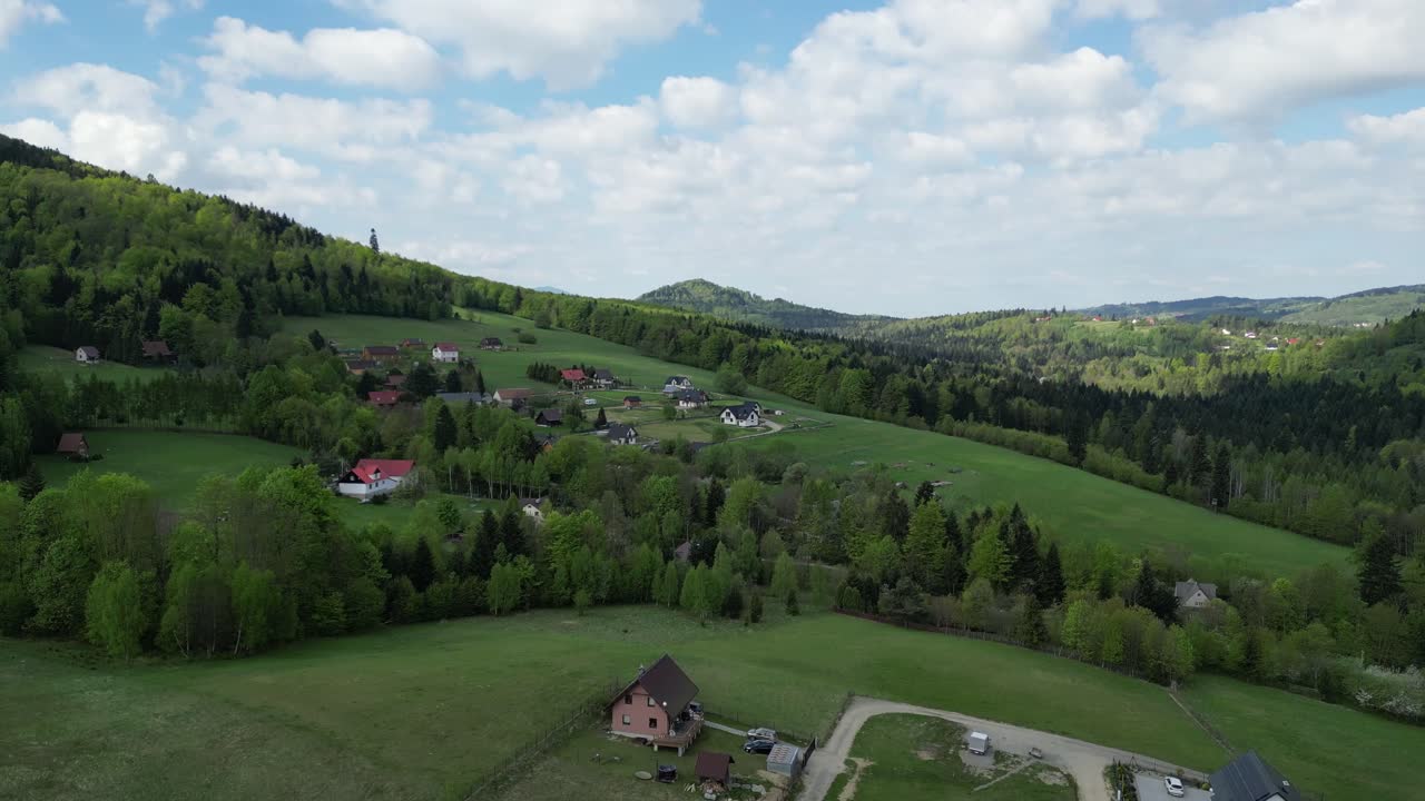 Mountain village in Beskid landscape - drone aerial 4K