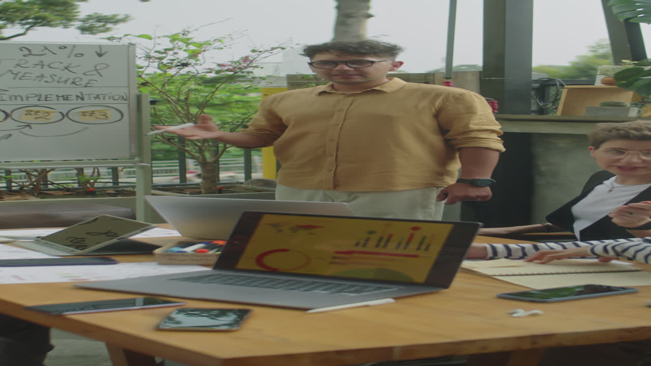 Marketing Specialist Presenting SMM Plan on Outdoor Meeting