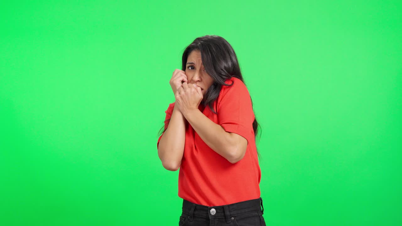 Scared Woman Flinching and Showing Fear on Green Screen