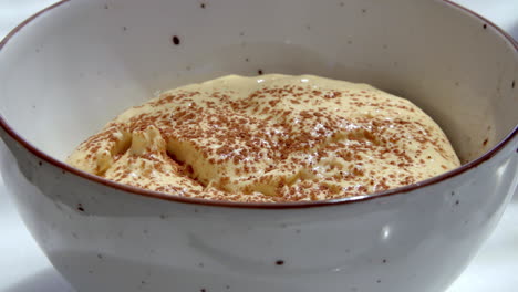 delicious homemade tiramisu in a white bowl