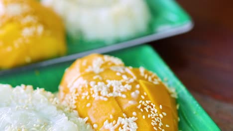 hand serving traditional thai dessert on a plate