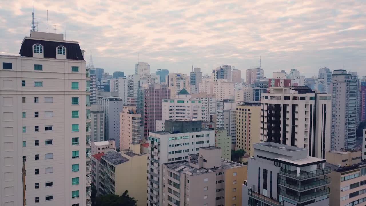 Flight between buildings in business centre of S&atilde;o Paulo, Brazil, aerial shot
