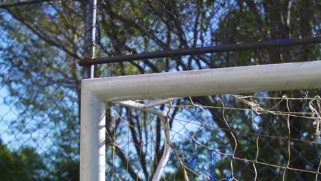 soccer ball hitting the goal post in slow motion
