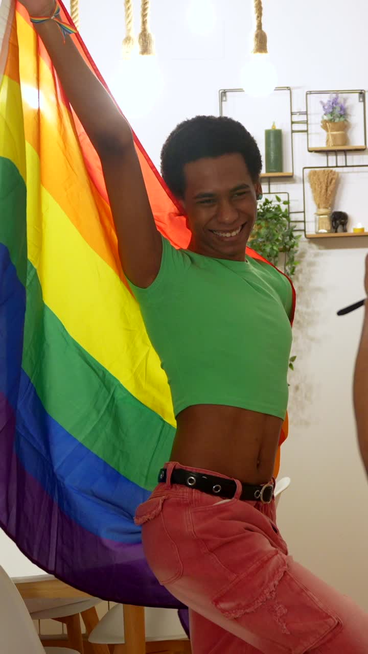 Two people celebrating pride with rainbow flag