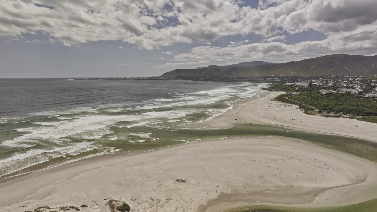 Hermanus South Africa Aerial v3 flyover Grotto beach capturing the natural breach connecting the river to the sea, coastal townscape and mountain landscape - Shot with Mavic 3 Pro Cine - Jan 8th 2024