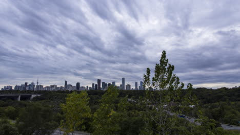 timelapse of stormy, overcast sky over the downtown toronto skyline from chester hill lookout