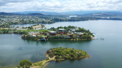 aerial drone flyover famous mona old and new art museum architecture in hobart, tasmania 4k