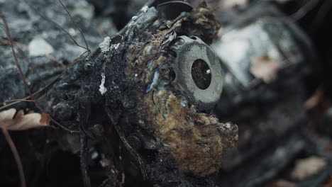 view inside fire damaged and abandoned vehicle console, focus pull