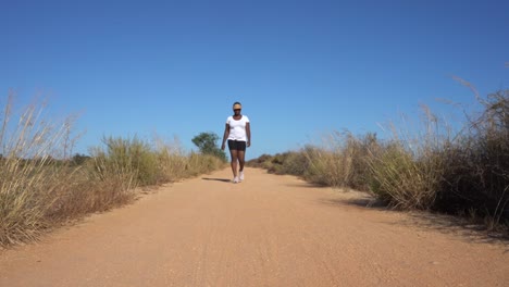 black woman stroll in the sand