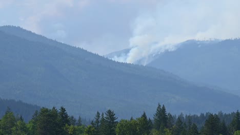 Smoke-on-the-Horizon:-Forest-Fire-Clouds-Loom-over-Adamas-Lake,-British-Columbia