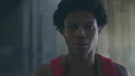 animation of blue trails over smiling biracial sportsman