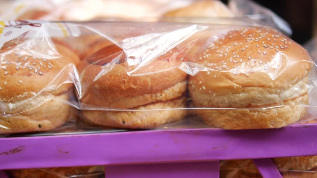 Freshly Baked Burger Buns in Plastic Wrap