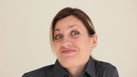 close-up of a woman with a surprised expression and wide eyes