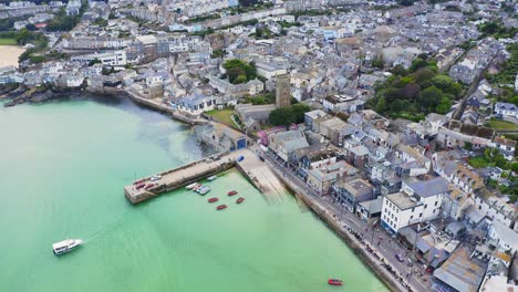 structured st ives harbour tourist ship departing port aerial