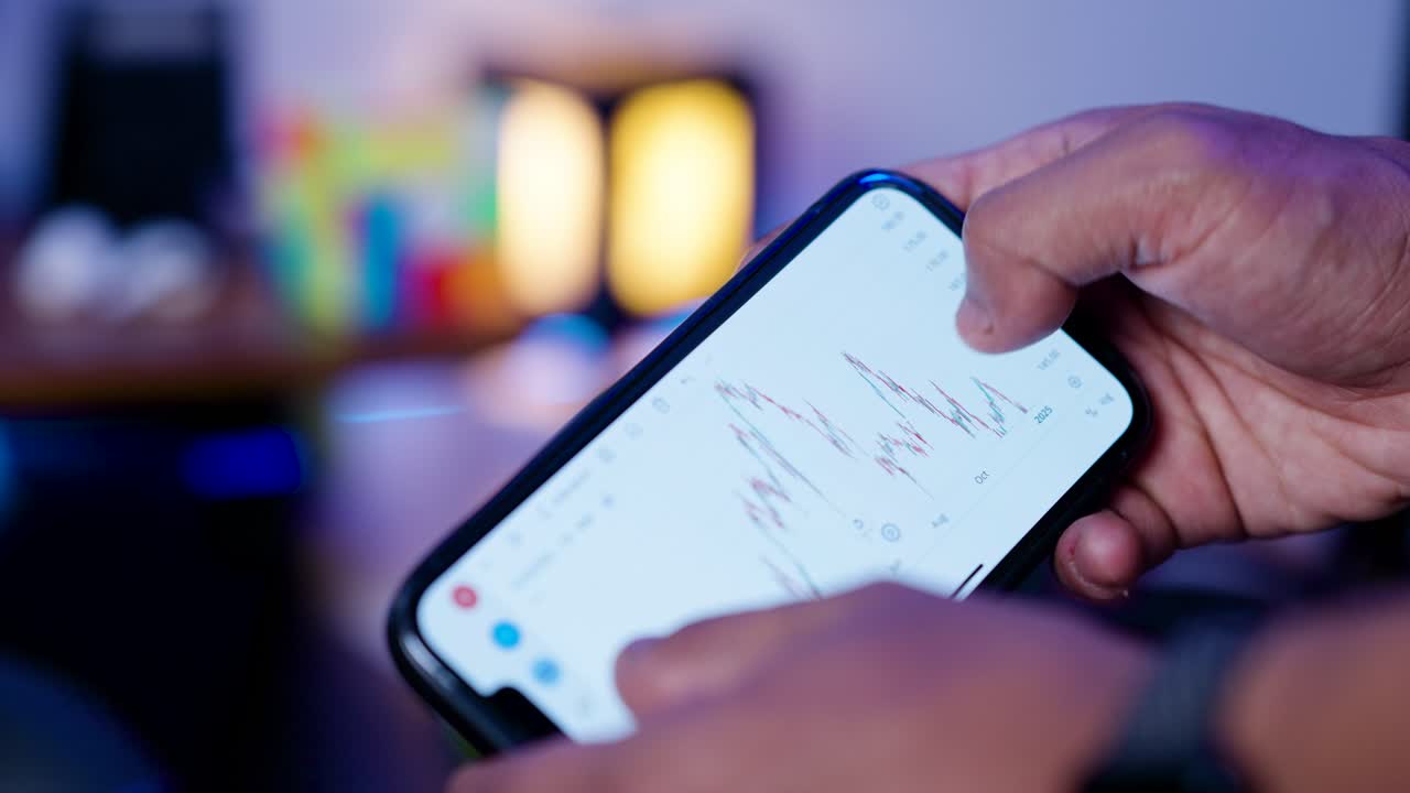 Finger Interacting with Digital Stock Market Data on Phone