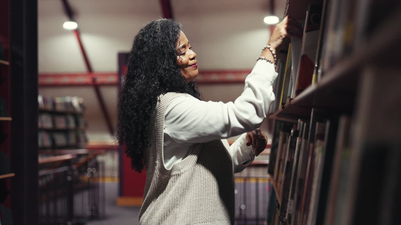 Woman reading a book in the library