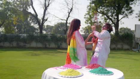 sweet indian couple celebrating holi